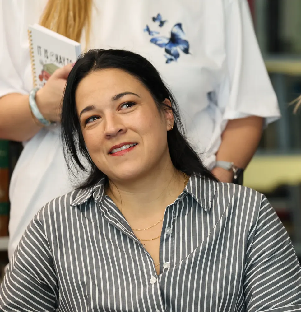 A participant looks up, smiling, at a Meridian Transformative Learning Lab