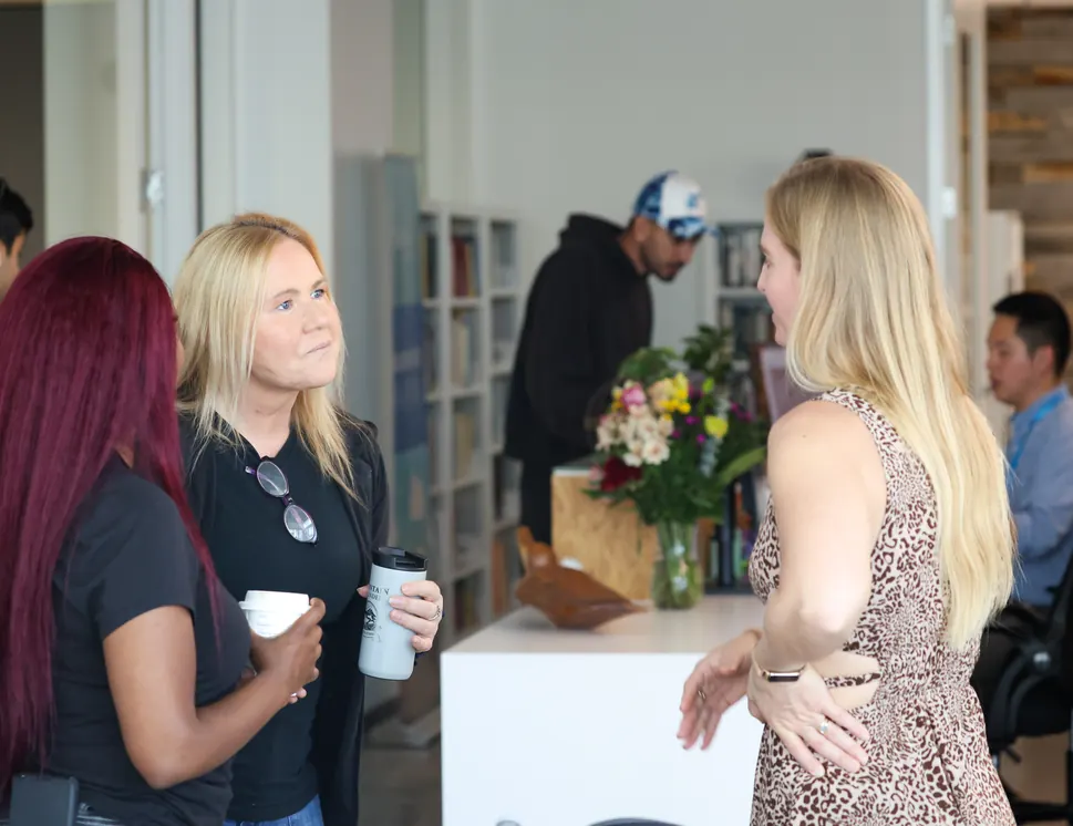 Participants talk over coffee at a Meridian Transformative Learning Lab