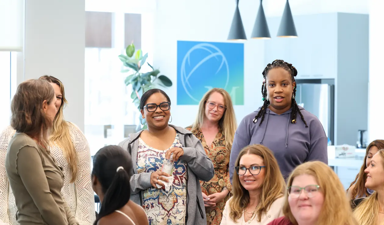 Participants gather and talk at a Meridian Transformative Learning Lab