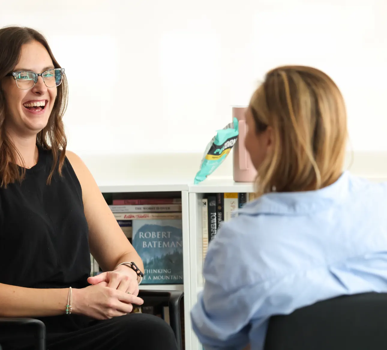 Two participants in conversation during a small-group session at a Meridian Transformative Learning Lab