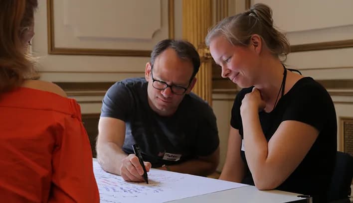 Students collaborating on a worksheet during an in-person class