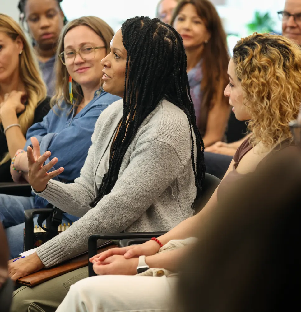 A participant speaks during a group session at a Meridian Transformative Learning Lab