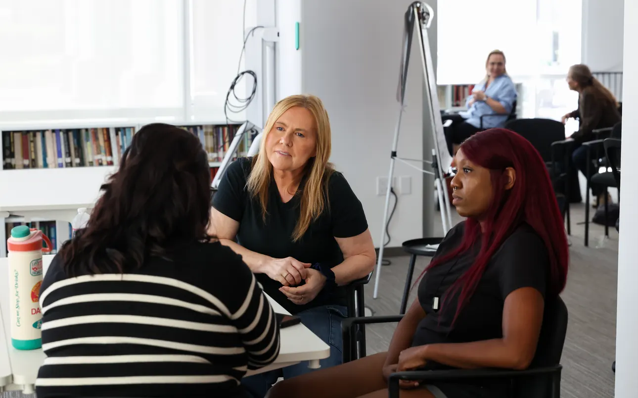 Participants in conversation during a small-group session at a Meridian Transformative Learning Lab