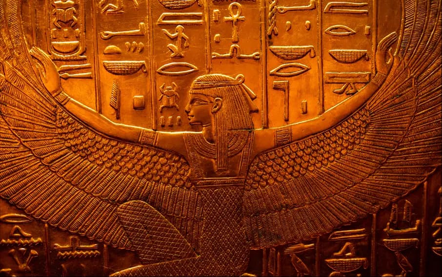 ancient egyptian god and hieroglyphics carving