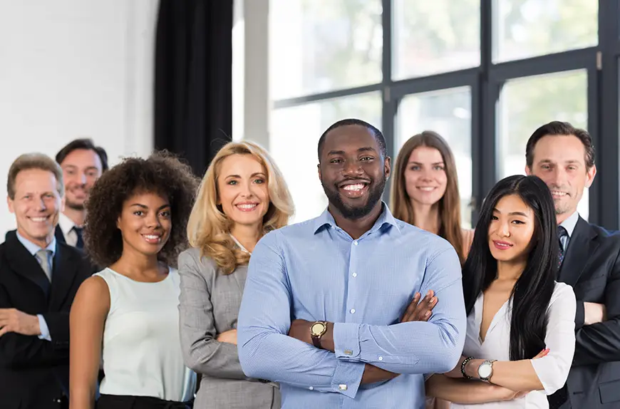 A group of international students pose for a class photo