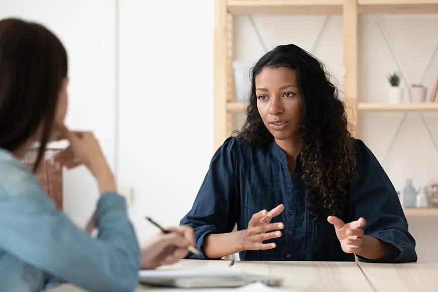 A confident leader interacts with a subordinate