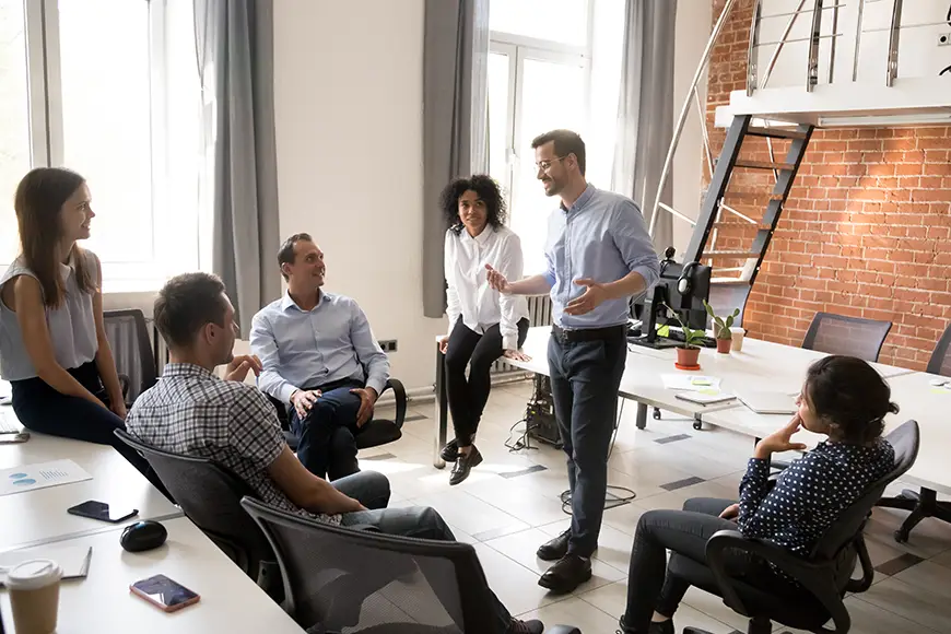 A confident manager leading a team-building activity