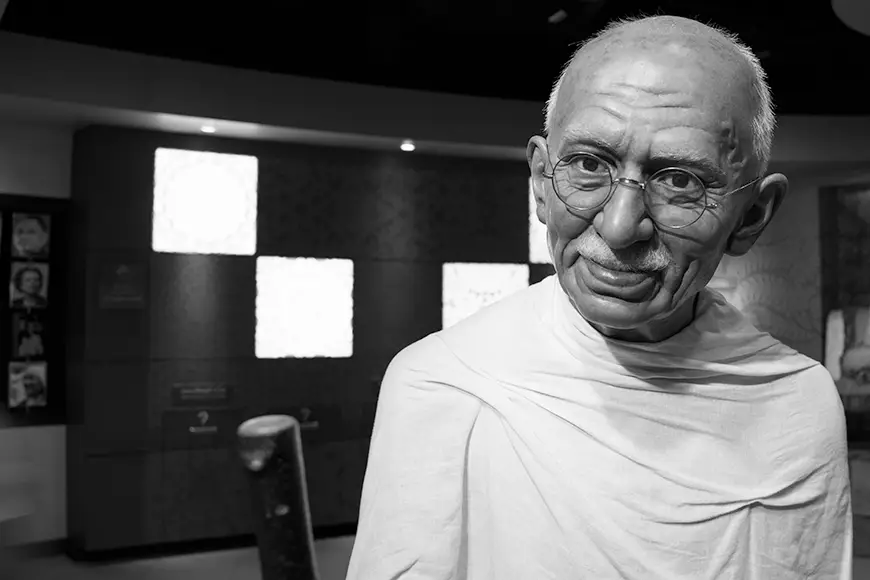 A picture of a clay figure of Mohandas Gandhi